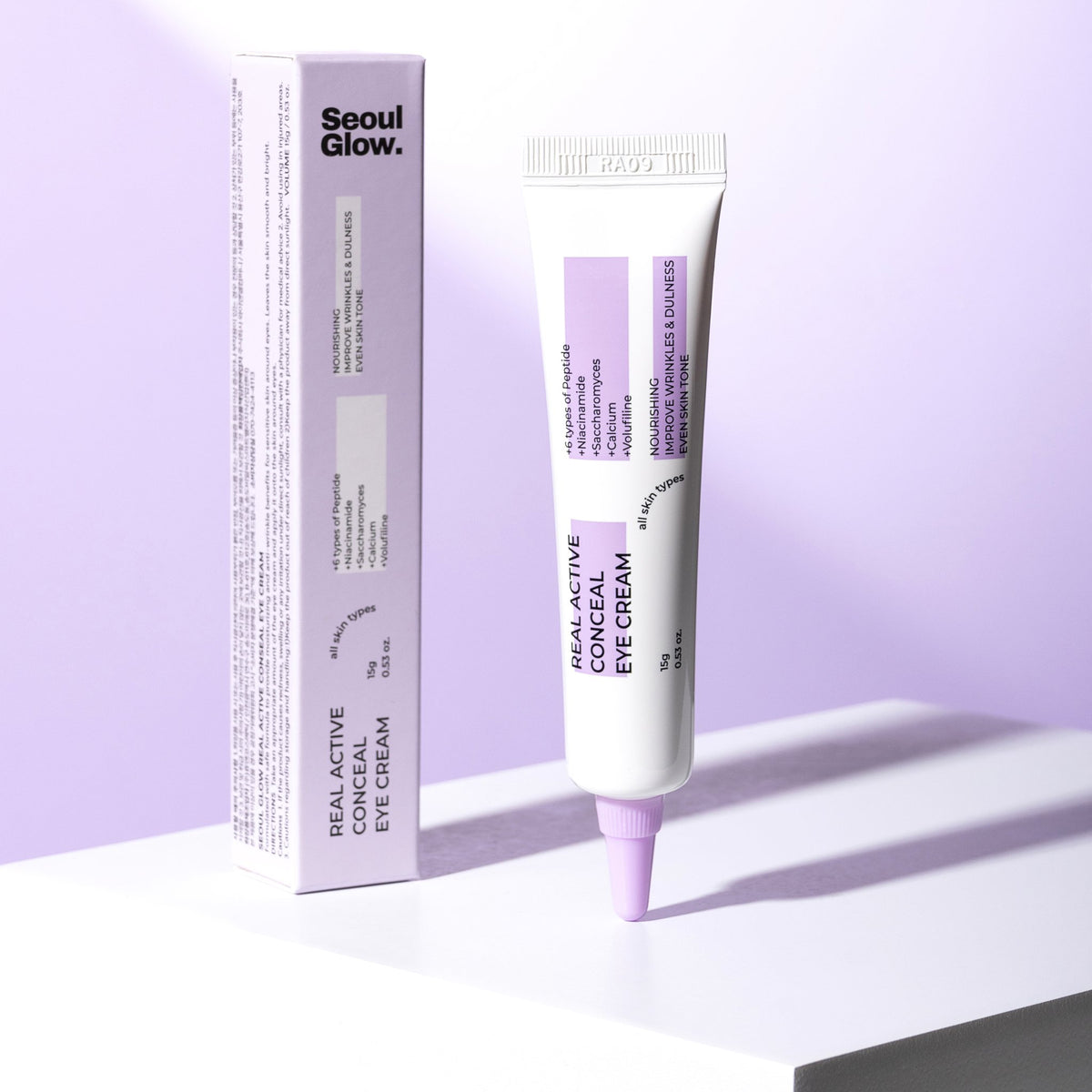 SEOULGLOW Real Active Conceal Eye Cream tube and box on a lilac backdrop